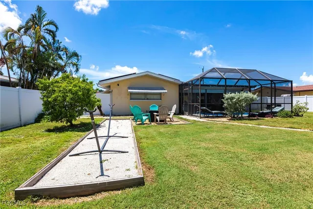 a swimming pool view with a seating space