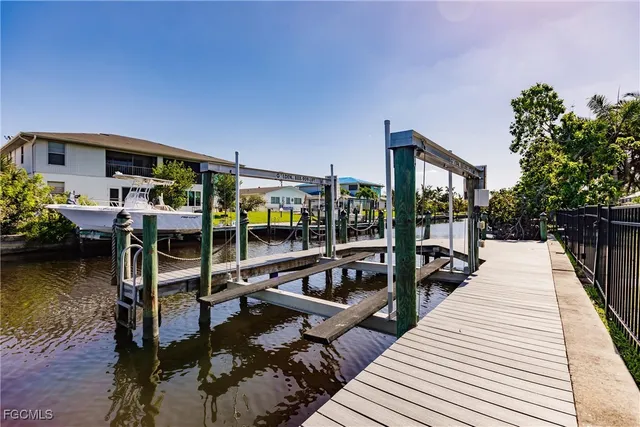 a view of a balcony with chairs and wooden floor