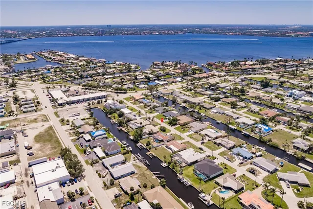 an aerial view of residential houses with city view