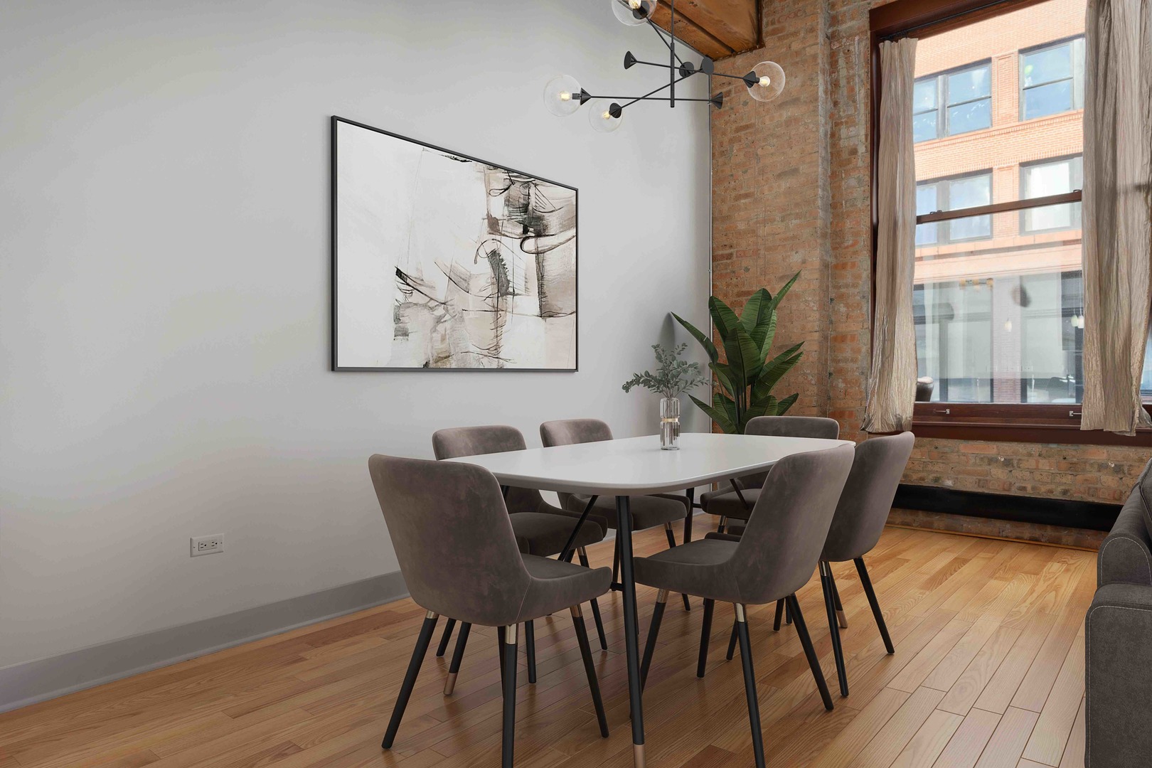 2303 South Michigan Avenue, Unit 305 Chicago, IL 60616 - Photo 11 of 22 a view of a dining room with furniture and wooden floor