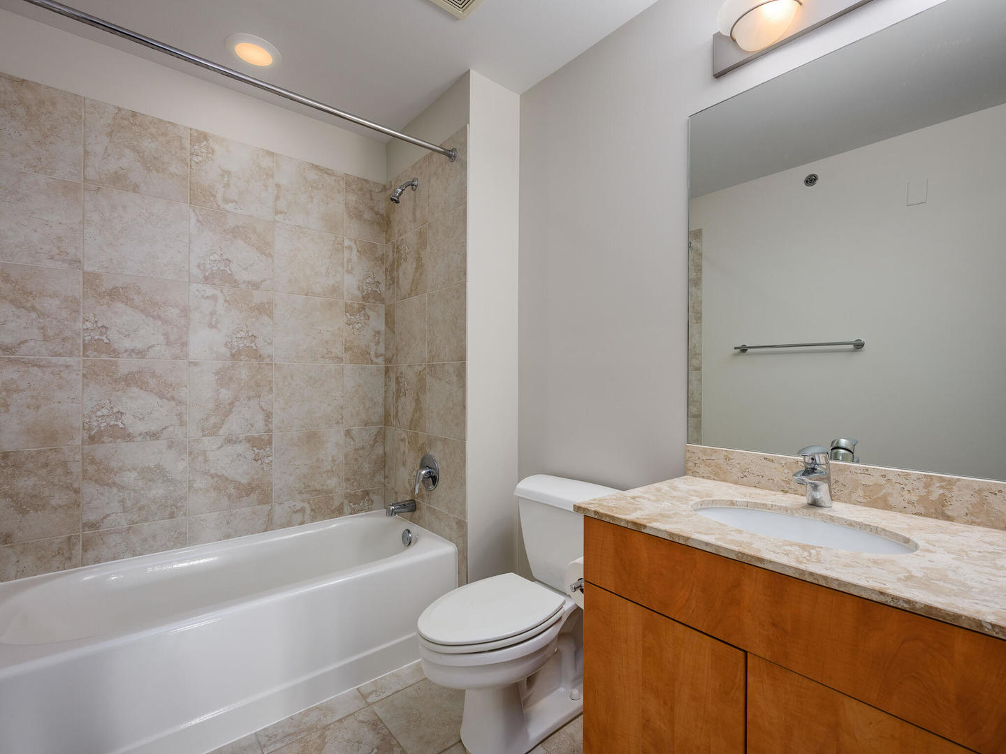 2303 South Michigan Avenue, Unit 305 Chicago, IL 60616 - Photo 19 of 22 a bathroom with a sink toilet and bathtub