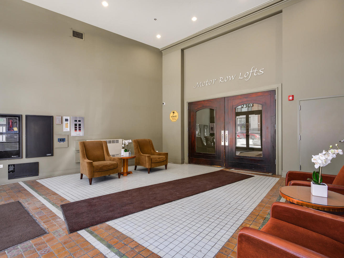 2303 South Michigan Avenue, Unit 305 Chicago, IL 60616 - Photo 3 of 22 a living room with furniture and a fireplace