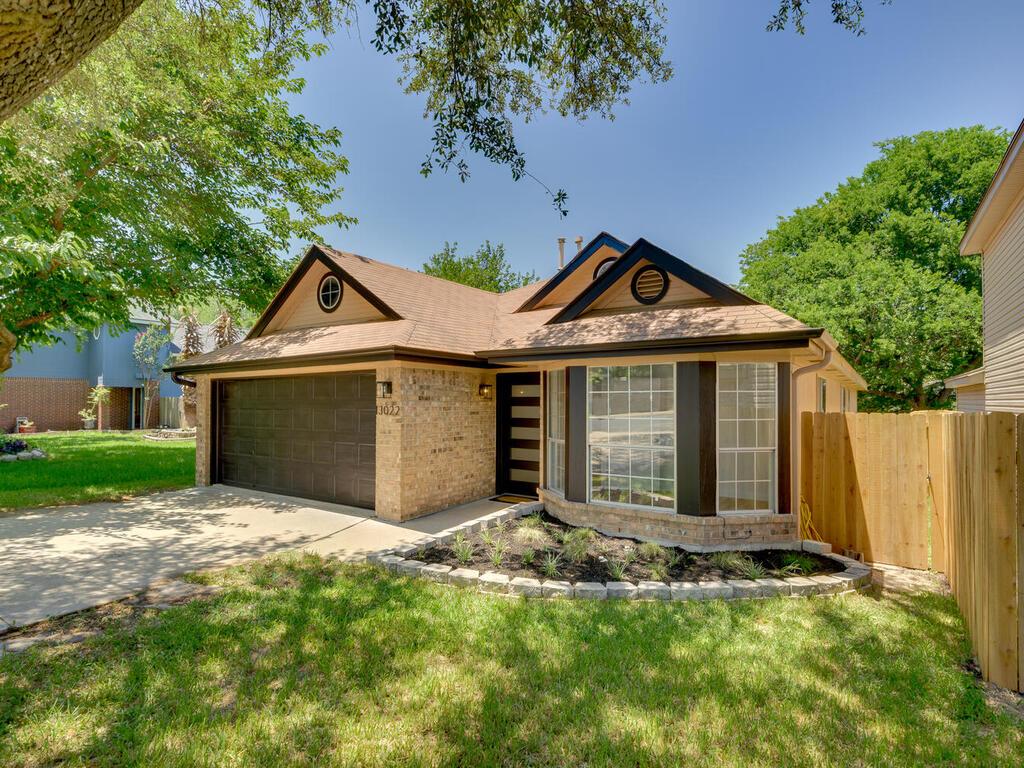 13022 Staton Drive Austin, TX 78727 - Photo 1 of 1 a front view of a house with a yard