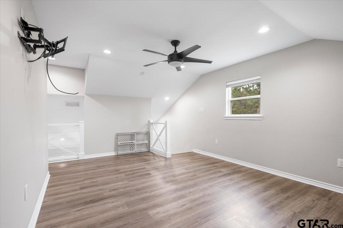 9235 Farm To Market Road 851 Rusk, TX 75785 - Photo 31 of 47 wooden floor in an empty room with a window