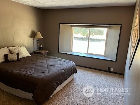 592 North Military Road Winlock, WA 98596 - Photo 14 of 21 a bedroom with a bed and window