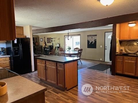 592 North Military Road Winlock, WA 98596 - Photo 6 of 21 a kitchen with stainless steel appliances kitchen island granite countertop a refrigerator a stove a sink and dishwasher