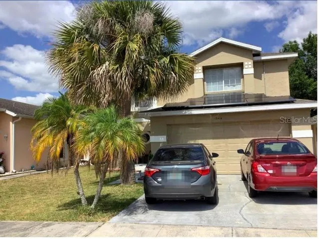 a car parked in front of a house