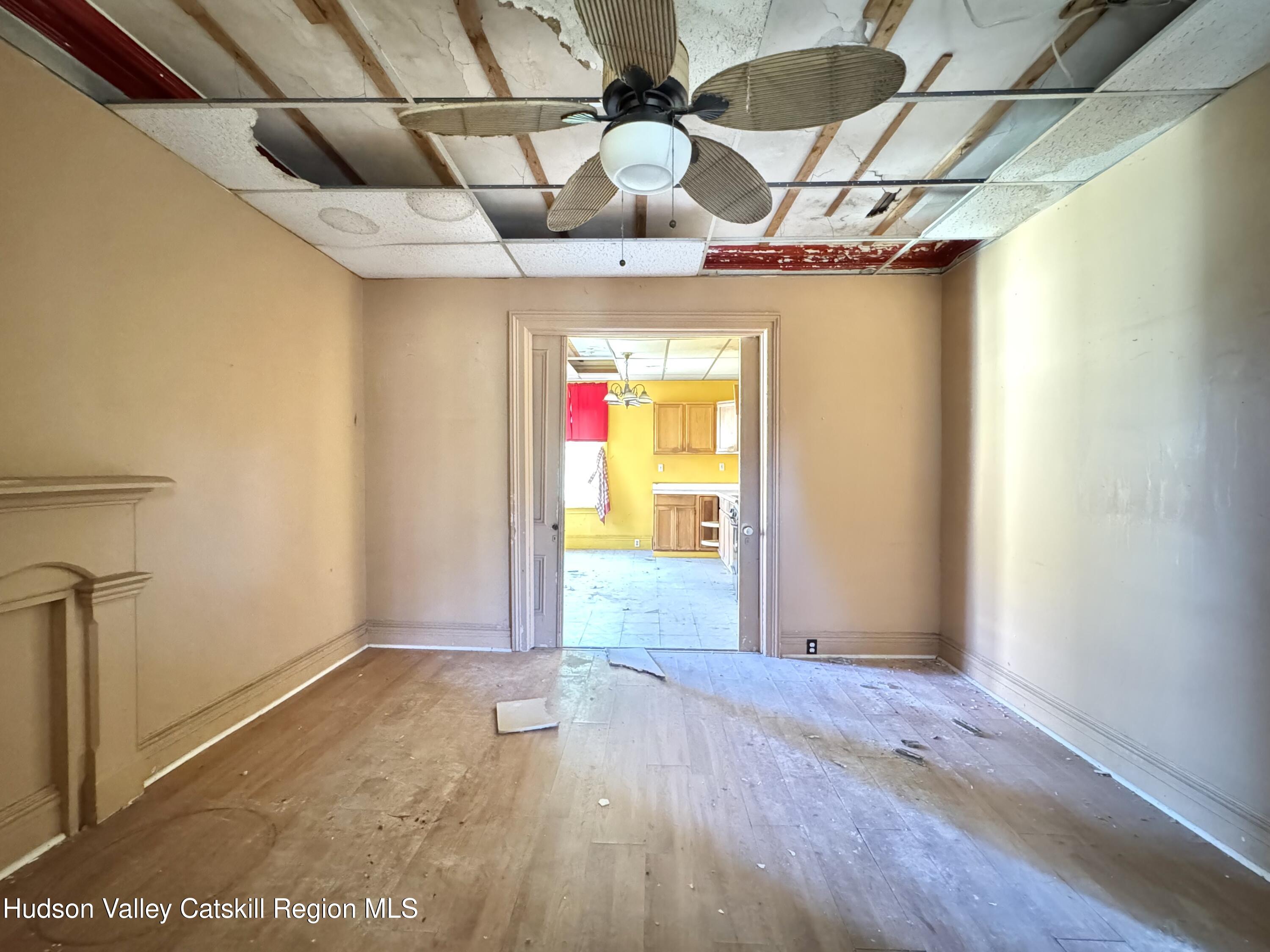 8 Howell Street Catskill, NY 12414 - Photo 2 of 14 a view of a room with wooden floor