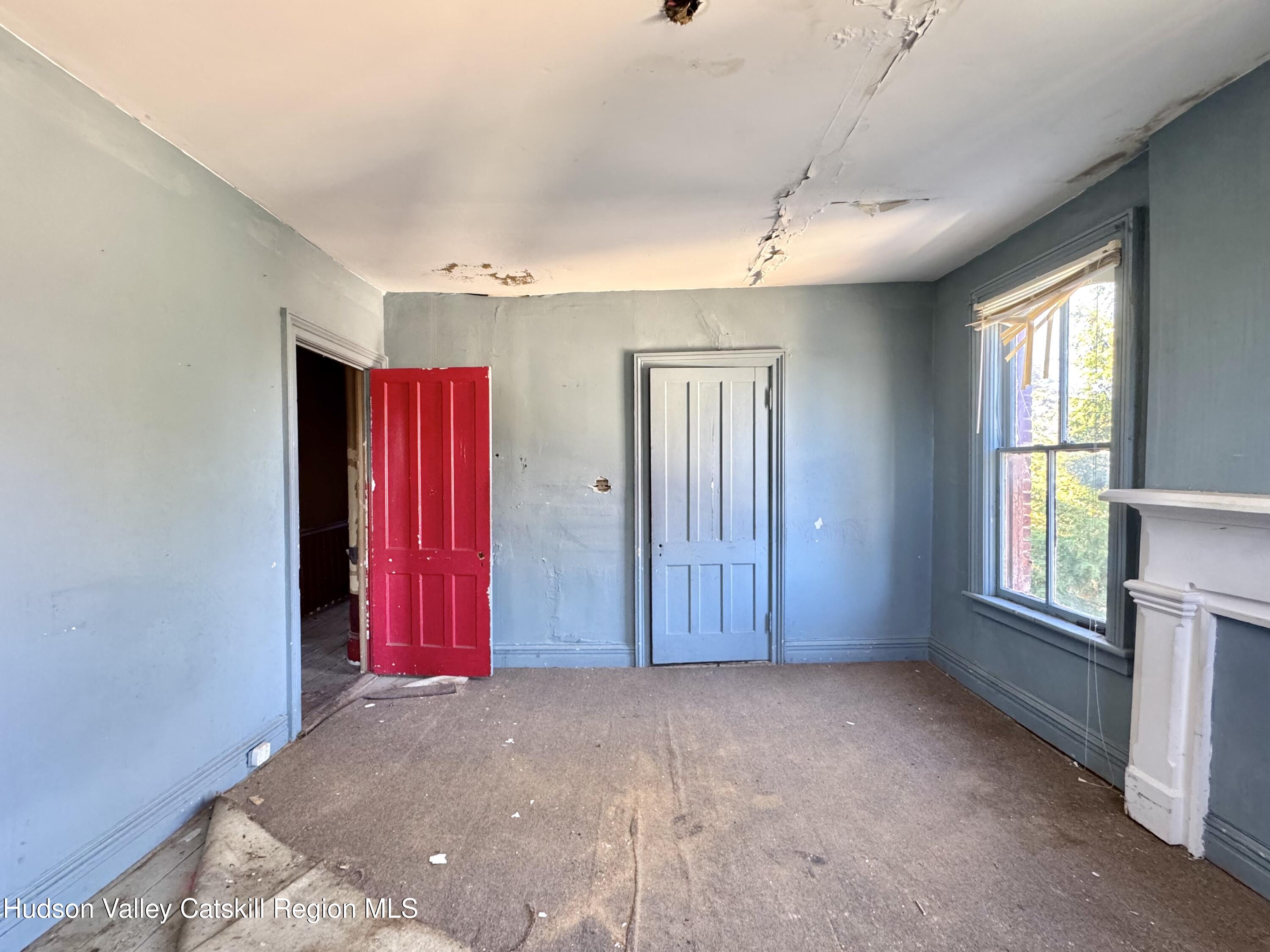 8 Howell Street Catskill, NY 12414 - Photo 8 of 14 a view of empty room with window