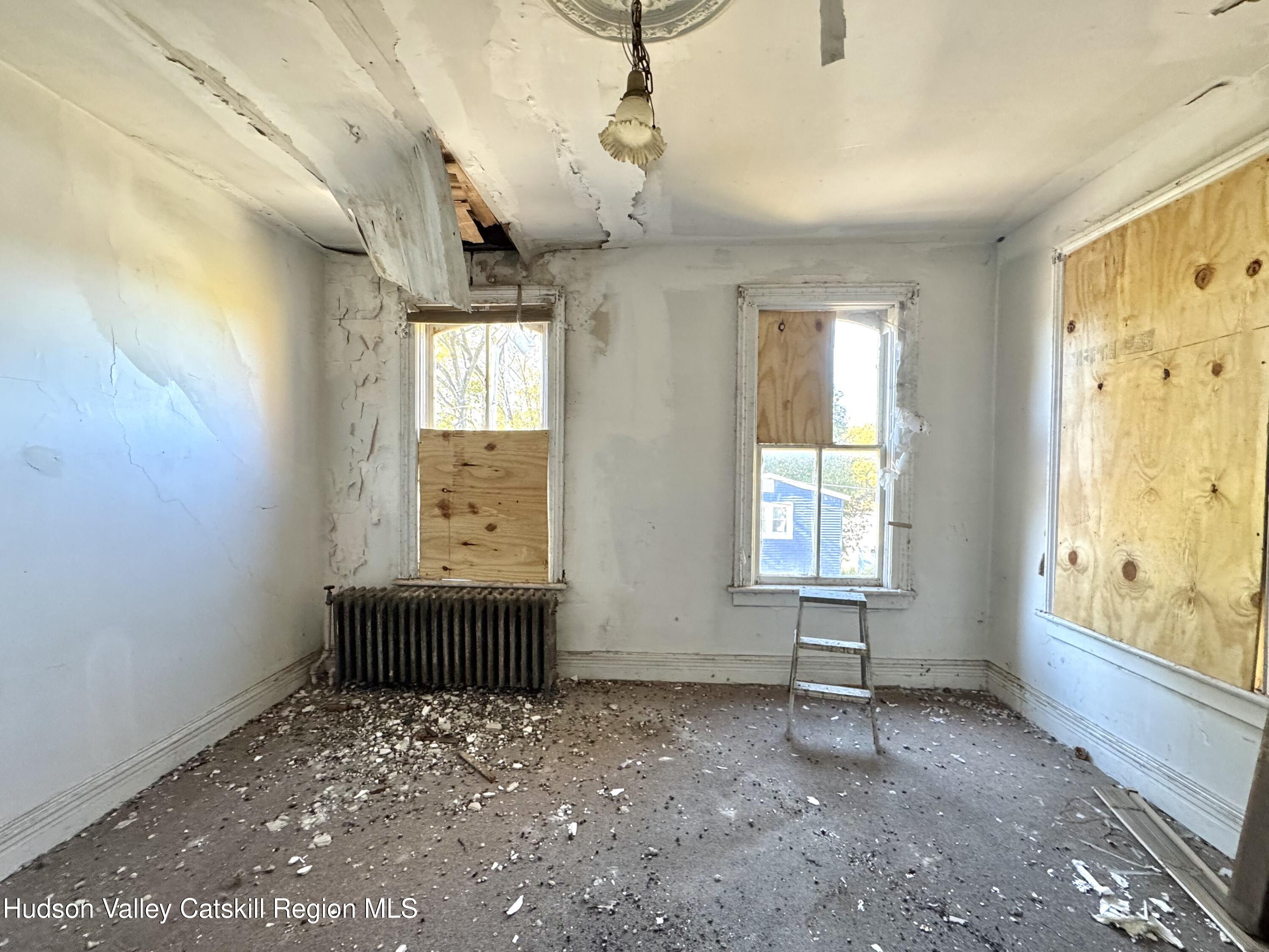 8 Howell Street Catskill, NY 12414 - Photo 10 of 14 a view of an empty room with a window
