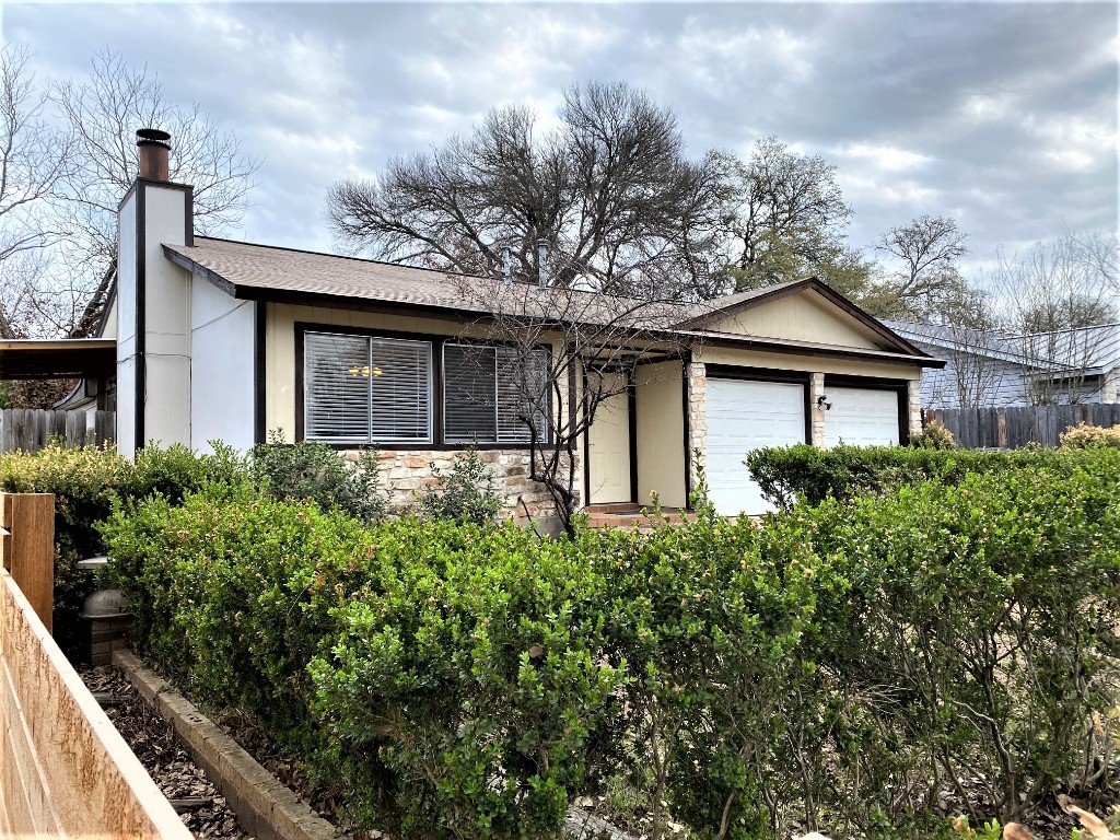 5502 Honey Dew Terrace Austin, TX 78749 - Photo 2 of 18 a front view of a house with garden
