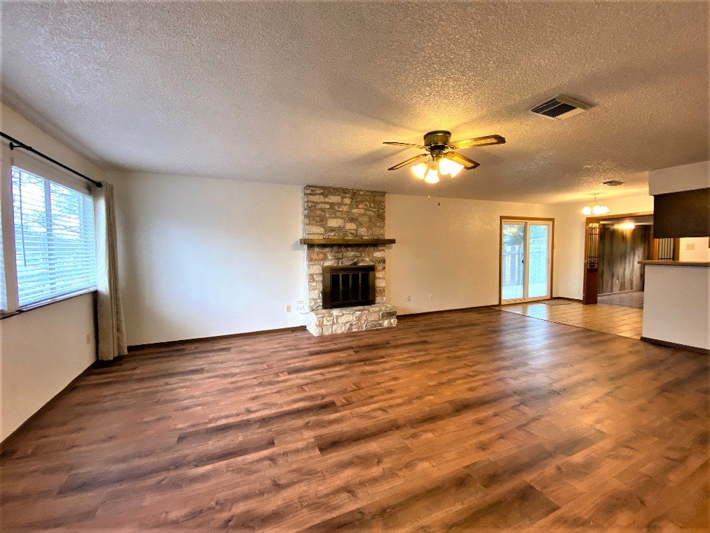 5502 Honey Dew Terrace Austin, TX 78749 - Photo 4 of 18 wooden floor in an empty room with a window