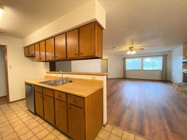 a kitchen with a sink and cabinets