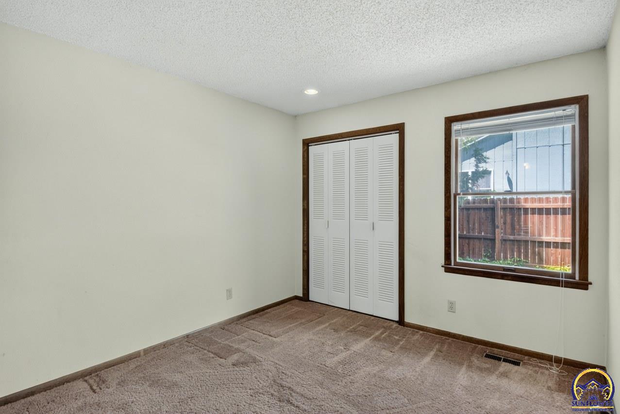 5701 Southwest Arrowhead Court Topeka, KS 66614 - Photo 26 of 36 Bedroom 3