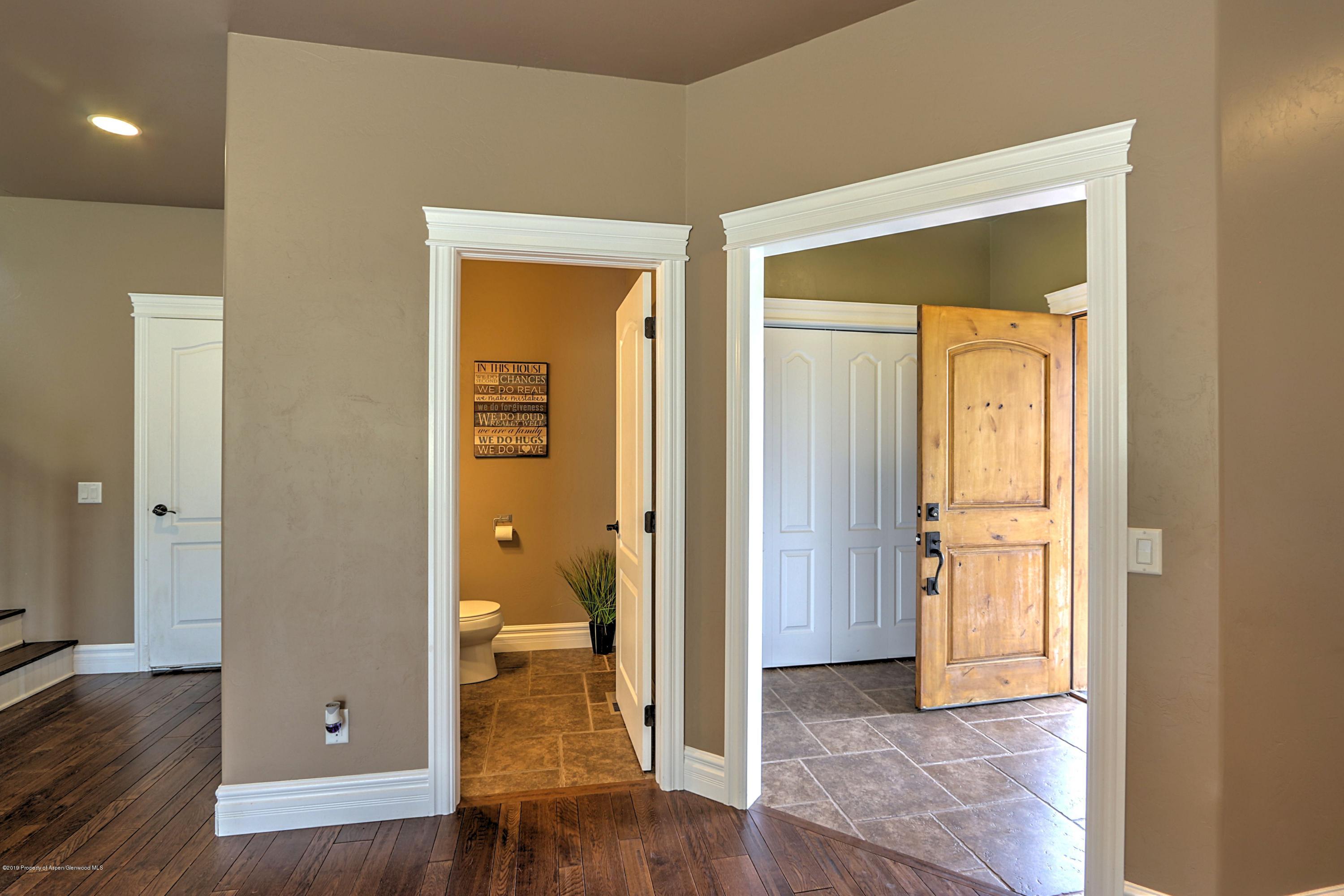 348 Faas Ranch Road New Castle, CO 81647 - Photo 3 of 31 half bath and front entry
