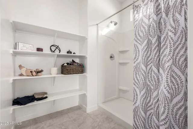 a bathroom with a bathtub and a shower curtain