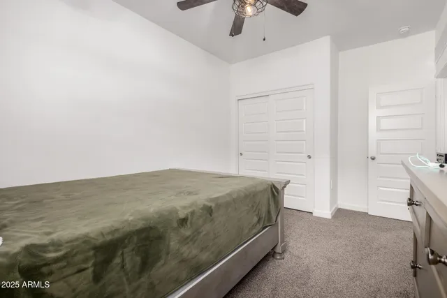 a bathroom with a double vanity sink toilet mirror and shower