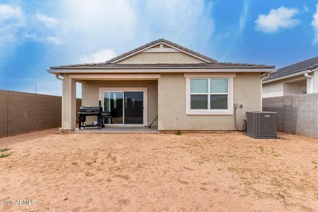 a view of a house with a yard and garage