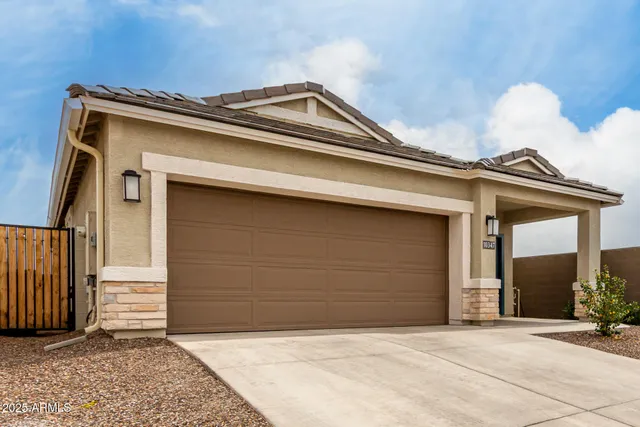 a view of backyard with garage