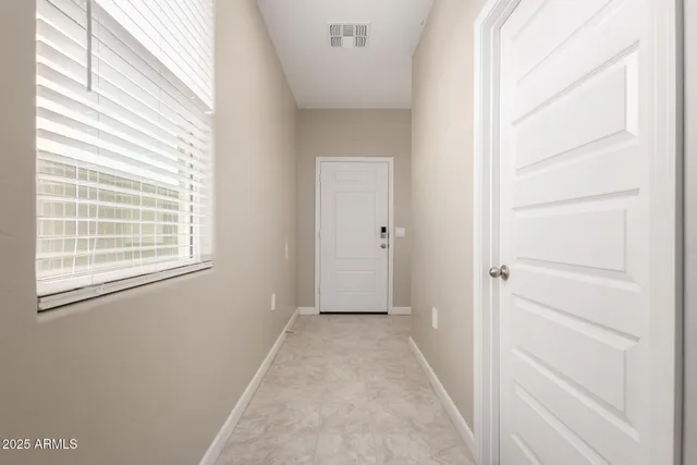 a view of a room that has a window in it