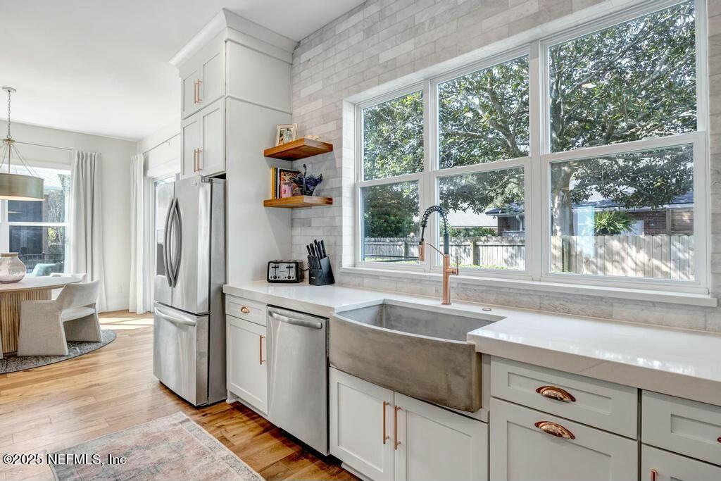 564 A1A North Ponte Vedra Beach, FL 32082 - Photo 14 of 34 a kitchen with a sink and a refrigerator