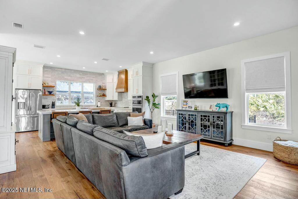 564 A1A North Ponte Vedra Beach, FL 32082 - Photo 2 of 34 a living room with furniture and a flat screen tv