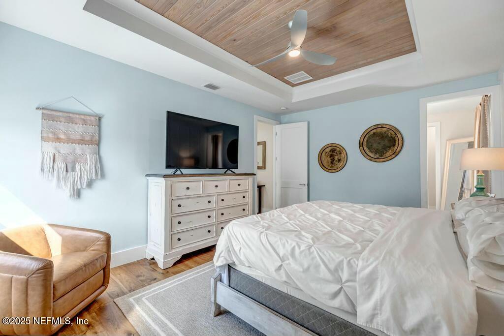 564 A1A North Ponte Vedra Beach, FL 32082 - Photo 24 of 34 a bedroom with a bed and a television