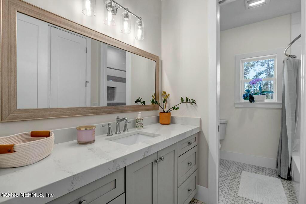 564 A1A North Ponte Vedra Beach, FL 32082 - Photo 28 of 34 a bathroom with a sink and a mirror