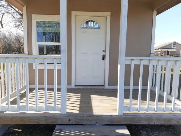 a view of a door and a window