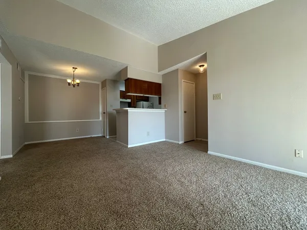 a view of an empty room with a fireplace