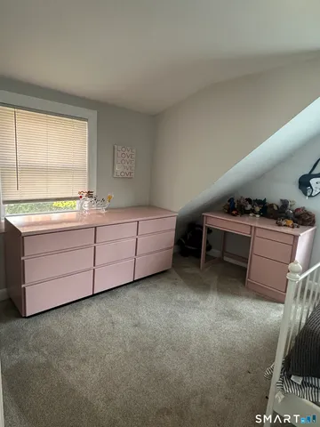 a room with furniture and window