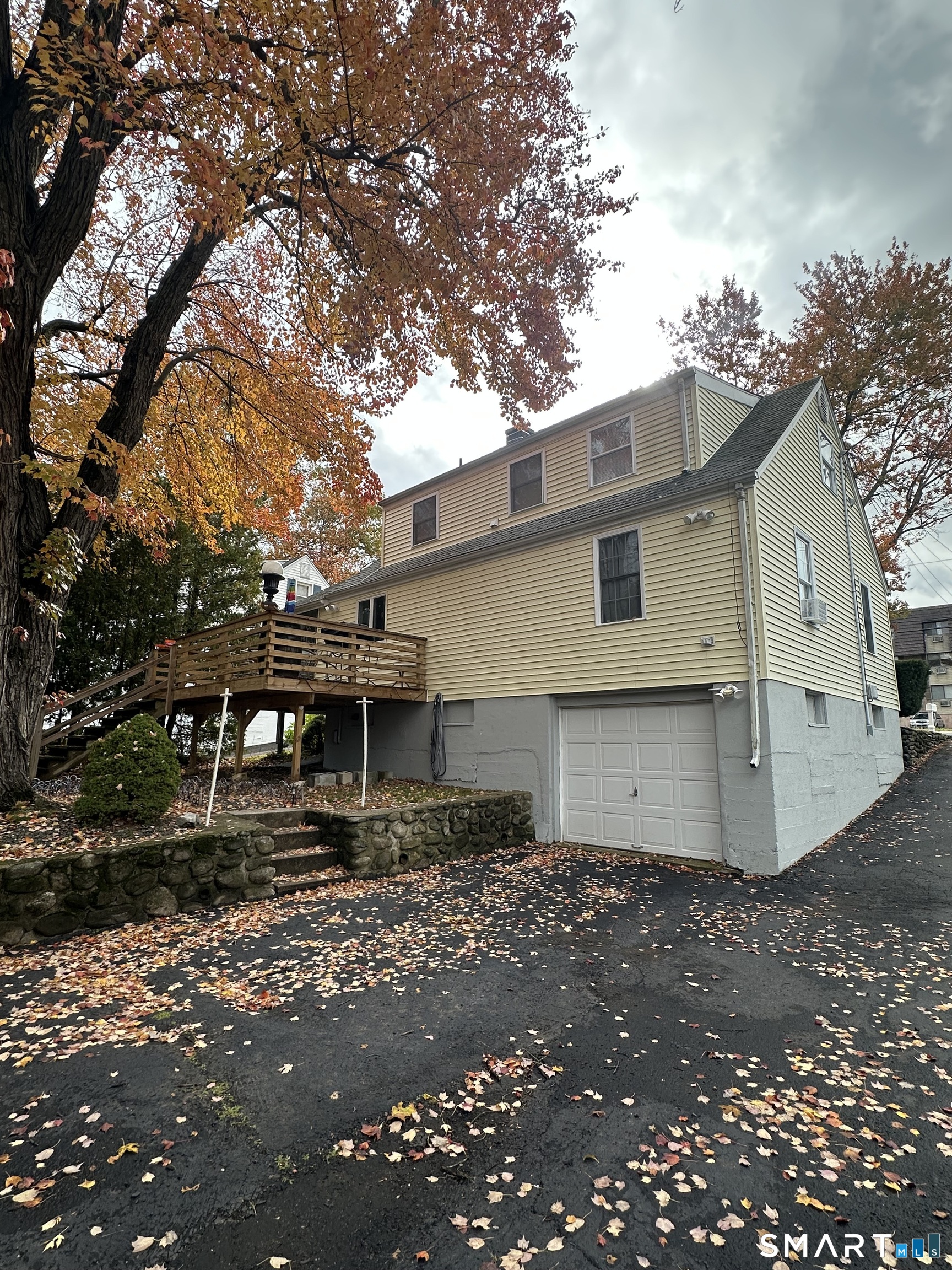 1031 Meriden Road Waterbury, CT 06705 - Photo 26 of 30 a front view of a house with garage