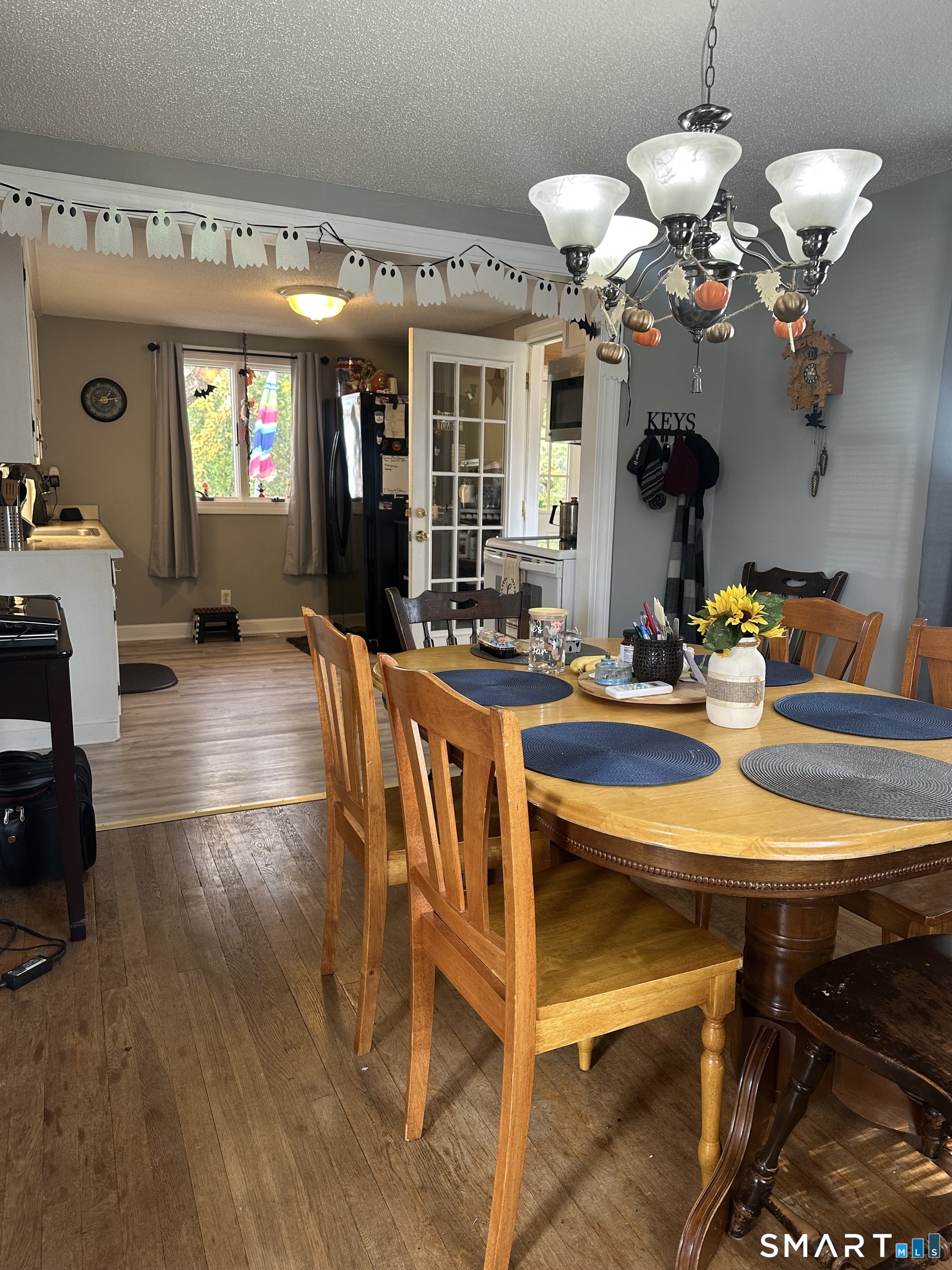 1031 Meriden Road Waterbury, CT 06705 - Photo 6 of 30 a view of a dining room with furniture and chandelier