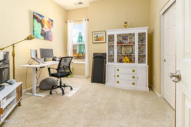 a view of a workspace with furniture