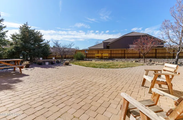 a view of swimming pool with outdoor seating and city view