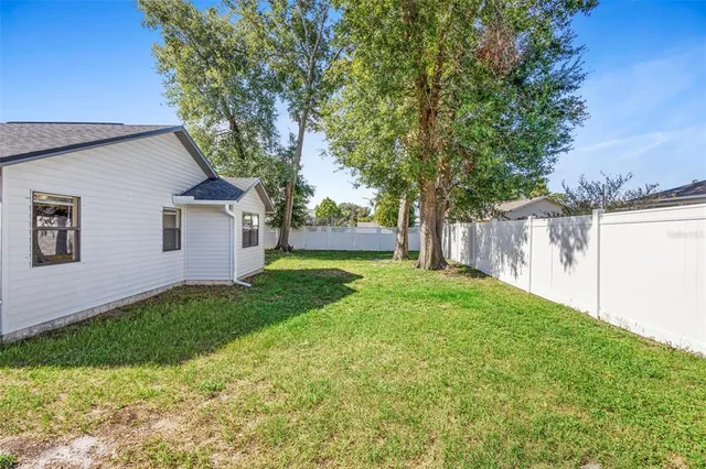 an aerial view of a house with swimming pool