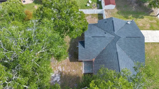 a view of a yard with potted plants