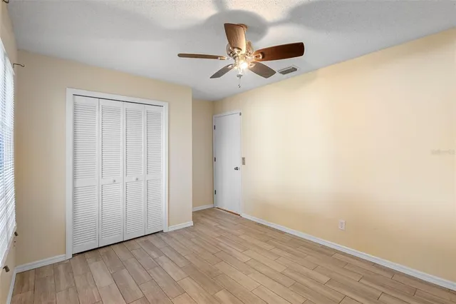 a bathroom with a sink a light fixture and a mirror