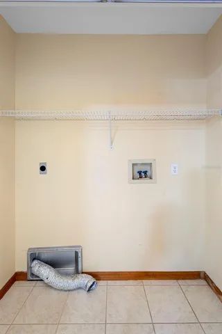a kitchen with a refrigerator and a sink