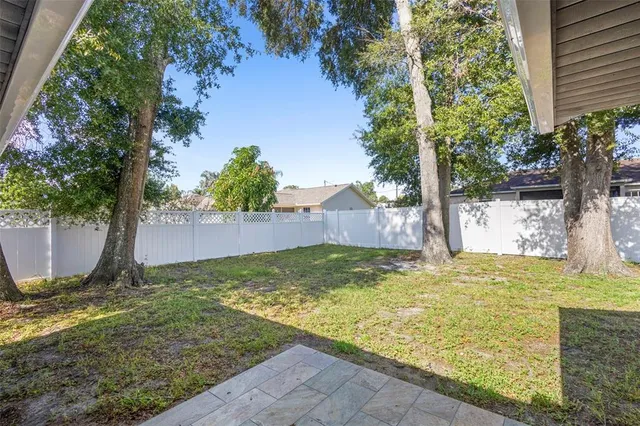 a house that has a tree in front of it