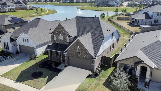 an aerial view of a house with outdoor space swimming pool and outdoor seating