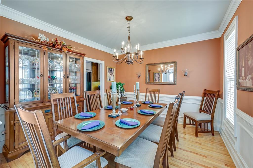32 St Ives Circle Winder, GA 30680 - Photo 17 of 38 a view of a dining room with furniture wooden floor and chandelier