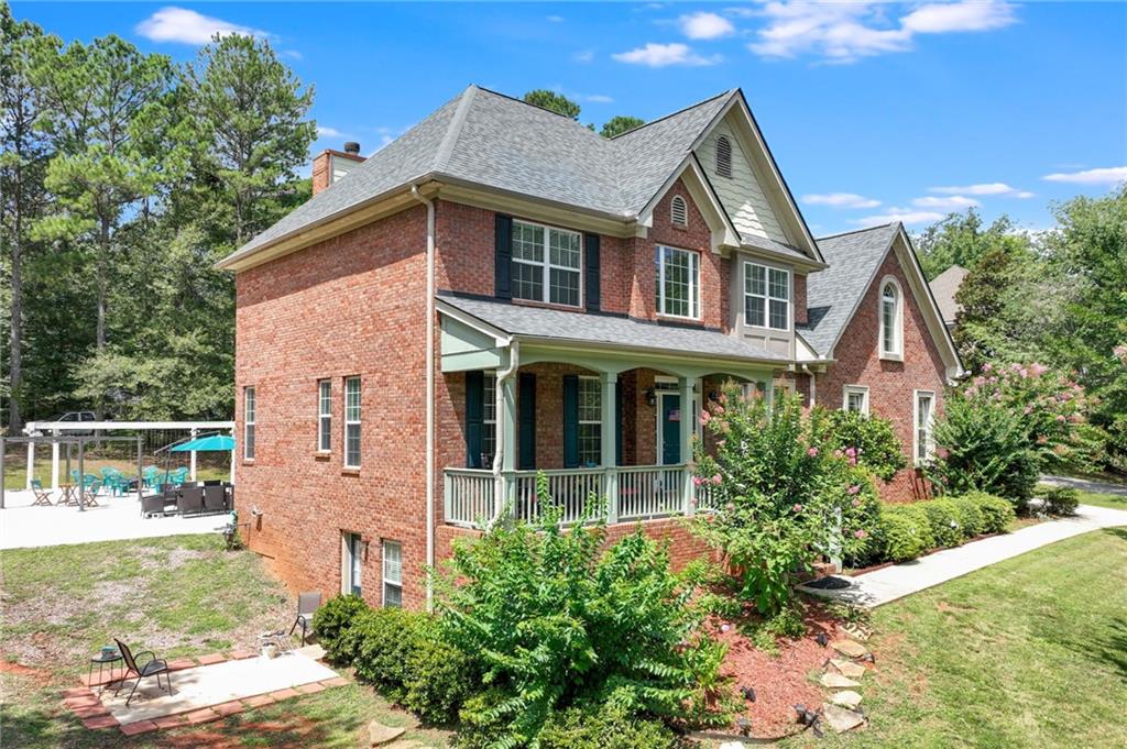 32 St Ives Circle Winder, GA 30680 - Photo 2 of 38 a front view of a house with garden