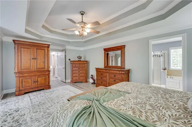 a bedroom with a bed and dresser