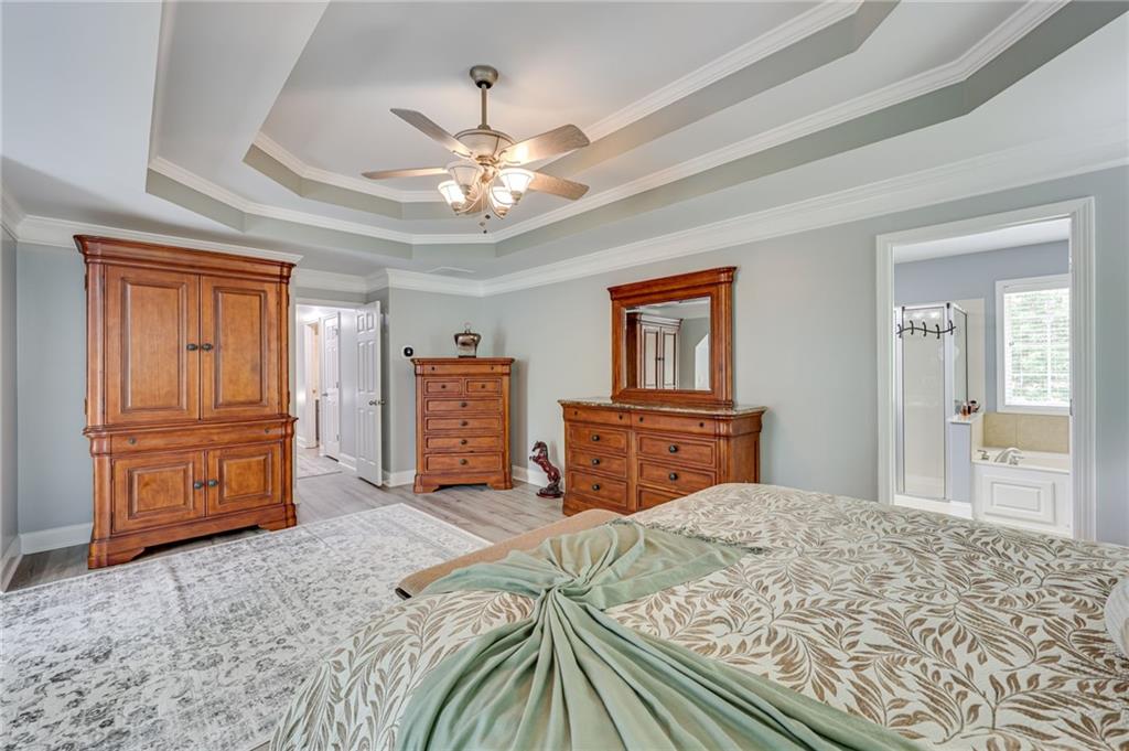 32 St Ives Circle Winder, GA 30680 - Photo 24 of 38 a bedroom with a bed and dresser