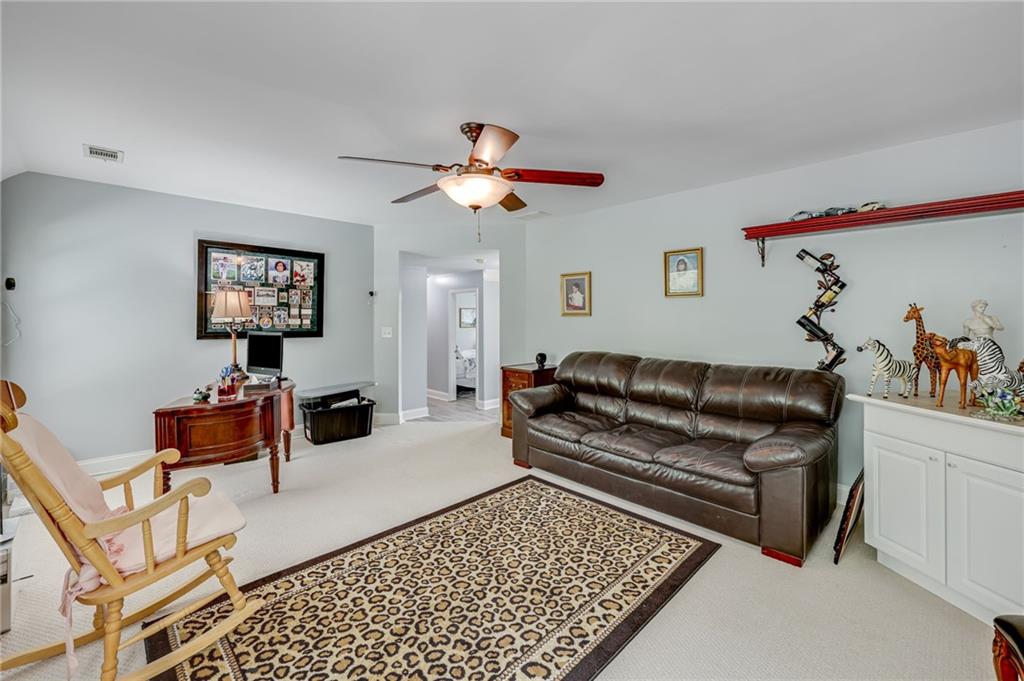32 St Ives Circle Winder, GA 30680 - Photo 32 of 38 a living room with furniture and a rug