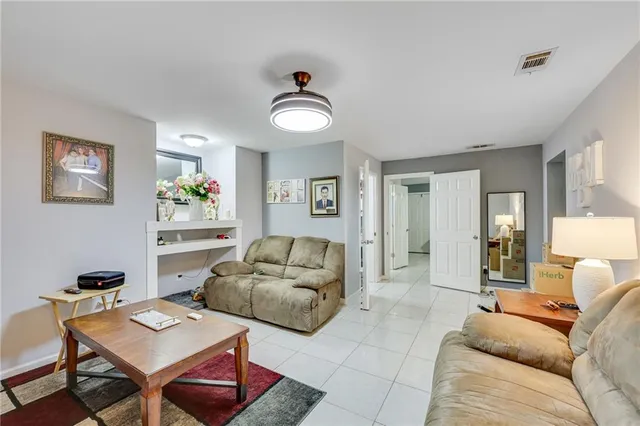a living room with furniture and a table