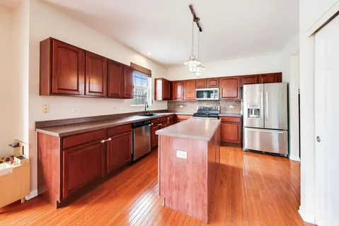 a view of a living room and kitchen
