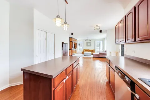 a kitchen with stainless steel appliances granite countertop wooden cabinets a sink and dishwasher