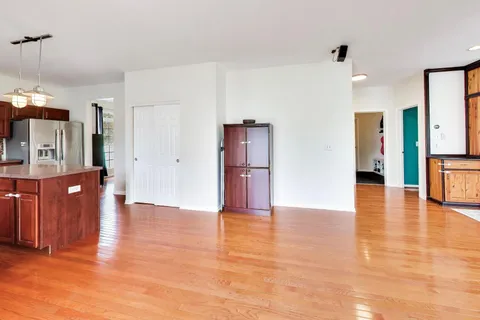 a living room with a fireplace furniture and a wooden floor